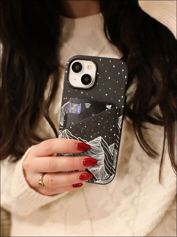 A woman holding a phone with a Pela case